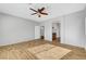 Spacious bedroom features wood-look flooring and a ceiling fan at 5919 Pavilion Lakes Ave, Las Vegas, NV 89122