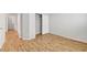 Bedroom with sliding door closet and wood-look flooring at 5919 Pavilion Lakes Ave, Las Vegas, NV 89122
