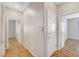 Hallway featuring wood-look flooring and neutral gray walls at 5919 Pavilion Lakes Ave, Las Vegas, NV 89122