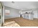 Spacious open-concept living space with a view of the modern kitchen at 5919 Pavilion Lakes Ave, Las Vegas, NV 89122