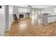 Spacious living room with modern flooring, fireplace, and ceiling fan at 5919 Pavilion Lakes Ave, Las Vegas, NV 89122