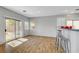 Open-concept living area with sliding glass doors and a breakfast bar at 5919 Pavilion Lakes Ave, Las Vegas, NV 89122