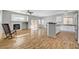 Bright living room with fireplace, ceiling fan, and an open floor plan at 5919 Pavilion Lakes Ave, Las Vegas, NV 89122