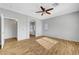 Spacious main bedroom with ensuite bath, wood flooring, ceiling fan, and lots of natural light at 5919 Pavilion Lakes Ave, Las Vegas, NV 89122