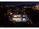 Night aerial view of luxury home featuring a pool and outdoor entertainment space at 609 Sleeping Dragon Dr, Henderson, NV 89012
