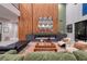 Modern living room featuring a fireplace, sleek decor, high ceilings, and plenty of seating at 609 Sleeping Dragon Dr, Henderson, NV 89012