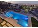 Modern pool and spa with sleek design, integrated lighting, and desert landscaping at 609 Sleeping Dragon Dr, Henderson, NV 89012