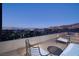Outdoor terrace with lounge seating, showcasing panoramic city and mountain views at 609 Sleeping Dragon Dr, Henderson, NV 89012