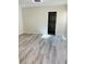 Spacious bedroom with wood-look floors and closet at 6255 Peneplain Ave, Las Vegas, NV 89139