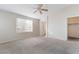 Main bedroom with ceiling fan, carpet, and ensuite bathroom at 66 Belle Soleil Ave, Las Vegas, NV 89123