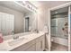 Clean bathroom with single vanity and shower/tub combo at 6735 Pleasant Flower St, Las Vegas, NV 89149