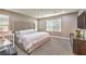 Spacious main bedroom with a king-size bed and plenty of natural light at 6735 Pleasant Flower St, Las Vegas, NV 89149