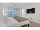 Main bedroom with sliding glass doors to balcony at 6815 Sage Gold Ct, North Las Vegas, NV 89086