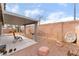 Relaxing backyard patio with seating area and gravel landscaping at 7017 Feather Pine St, Las Vegas, NV 89131