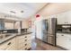 Kitchen boasts stainless steel refrigerator and granite counters at 7017 Feather Pine St, Las Vegas, NV 89131