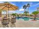 Inviting backyard oasis featuring a sparkling pool, spa, and built-in BBQ at 8774 Killians Greens Dr, Las Vegas, NV 89131