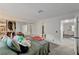 Bright bedroom with a double bed, mirrored closet, and view of bathroom and hallway at 929 Rockview Dr # 202, Las Vegas, NV 89128