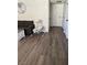 Living room showcasing gray couch and wood-look flooring at 929 Rockview Dr # 202, Las Vegas, NV 89128