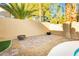 Relaxing backyard patio with built-in fire pit and seating area at 9904 Garamound Ave, Las Vegas, NV 89117