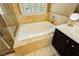Elegant bathroom featuring a large soaking tub and tile surround at 9904 Garamound Ave, Las Vegas, NV 89117