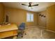 Comfortable bedroom with a ceiling fan and window shutters at 9904 Garamound Ave, Las Vegas, NV 89117