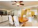 Dining room with wood table and chairs, open to living area at 9904 Garamound Ave, Las Vegas, NV 89117