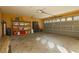 Attached two-car garage with built-in shelving and ample storage at 9904 Garamound Ave, Las Vegas, NV 89117