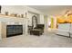 Spacious living room featuring a fireplace and comfortable seating at 9904 Garamound Ave, Las Vegas, NV 89117