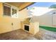 Outdoor kitchen with built-in grill and stone countertops at 9904 Garamound Ave, Las Vegas, NV 89117