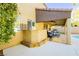 Covered patio with built-in bar and seating area at 9904 Garamound Ave, Las Vegas, NV 89117