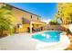 Inviting kidney-shaped pool with a spacious patio and built-in BBQ at 9904 Garamound Ave, Las Vegas, NV 89117