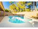 Inviting swimming pool with waterfall feature at 9904 Garamound Ave, Las Vegas, NV 89117