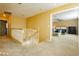 Upstairs hallway with view into bedroom and staircase at 9904 Garamound Ave, Las Vegas, NV 89117