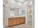 Double vanity bathroom with a large mirror and walk-in closet at 10375 Pescado Ln, Las Vegas, NV 89135
