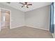 Spacious bedroom with ceiling fan and neutral walls at 10375 Pescado Ln, Las Vegas, NV 89135
