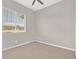 Spacious bedroom with neutral walls, ceiling fan, and window coverings at 10375 Pescado Ln, Las Vegas, NV 89135