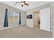 Bright bedroom featuring a window with blue curtains at 10375 Pescado Ln, Las Vegas, NV 89135