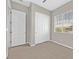 Bright bedroom with carpet flooring, double door closet and window coverings at 10375 Pescado Ln, Las Vegas, NV 89135
