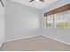 Spacious bedroom with neutral walls, ceiling fan and large windows at 10375 Pescado Ln, Las Vegas, NV 89135