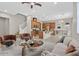 Open living space with kitchen, island, and stairs at 10375 Pescado Ln, Las Vegas, NV 89135
