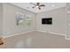 Spacious living room with large TV and tile flooring at 10375 Pescado Ln, Las Vegas, NV 89135