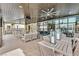 Community patio with seating, dining areas, and ceiling fans at 10375 Pescado Ln, Las Vegas, NV 89135