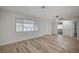 Bright and airy living room with hardwood flooring and large window at 105 Ash St, Henderson, NV 89015