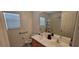 Bathroom with double vanity, shower, and bathtub at 12064 Avery Meadows Ave, Las Vegas, NV 89138