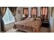 Bright bedroom with large window and neutral decor at 12064 Avery Meadows Ave, Las Vegas, NV 89138