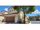 Two-story house with attached garage and landscaping at 12064 Avery Meadows Ave, Las Vegas, NV 89138