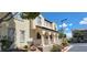 Townhouse exterior with arched entryway and landscaping at 12064 Avery Meadows Ave, Las Vegas, NV 89138