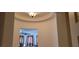 Elegant hallway with arched ceilings and light fixture at 12064 Avery Meadows Ave, Las Vegas, NV 89138