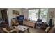 Bright living room with ample seating and large windows at 12064 Avery Meadows Ave, Las Vegas, NV 89138