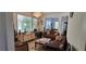 Open living room with comfortable seating and large windows at 12064 Avery Meadows Ave, Las Vegas, NV 89138